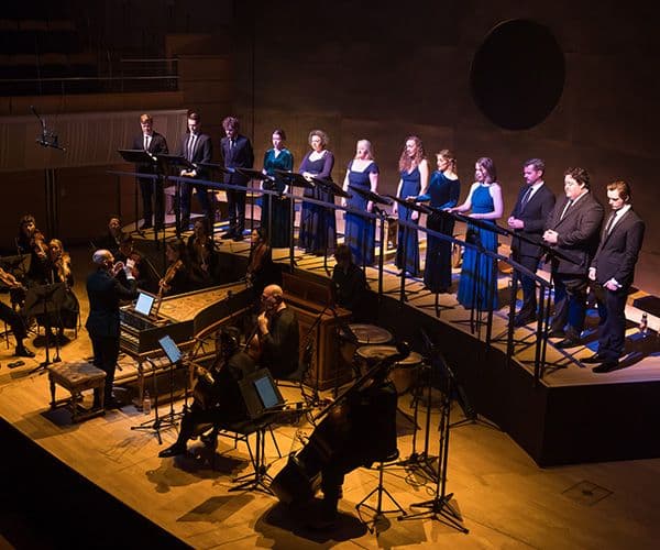 Performance of Handel's Messiah at City Recital Hall, with 12 singers standing in a curve behind Orchestra of the Antipodes