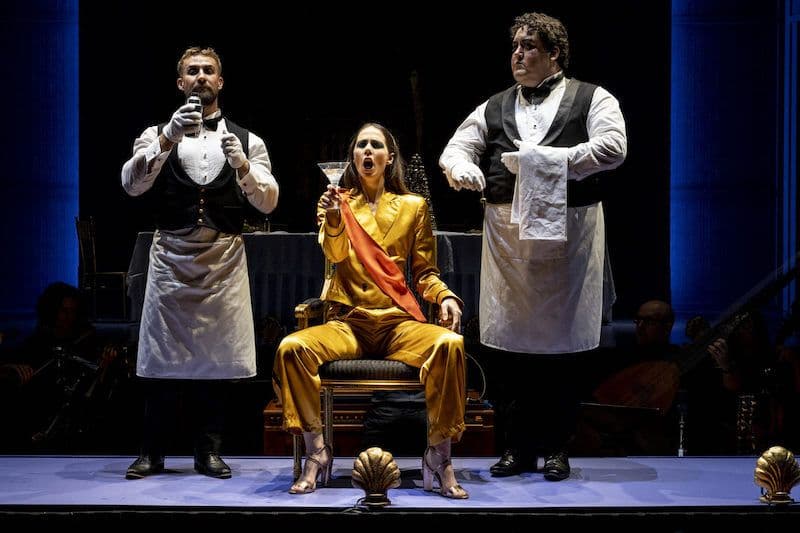 Heath Keating as Waiter, Anna Dowsley as Orontea, and Andrew O'Connor as Gelone.