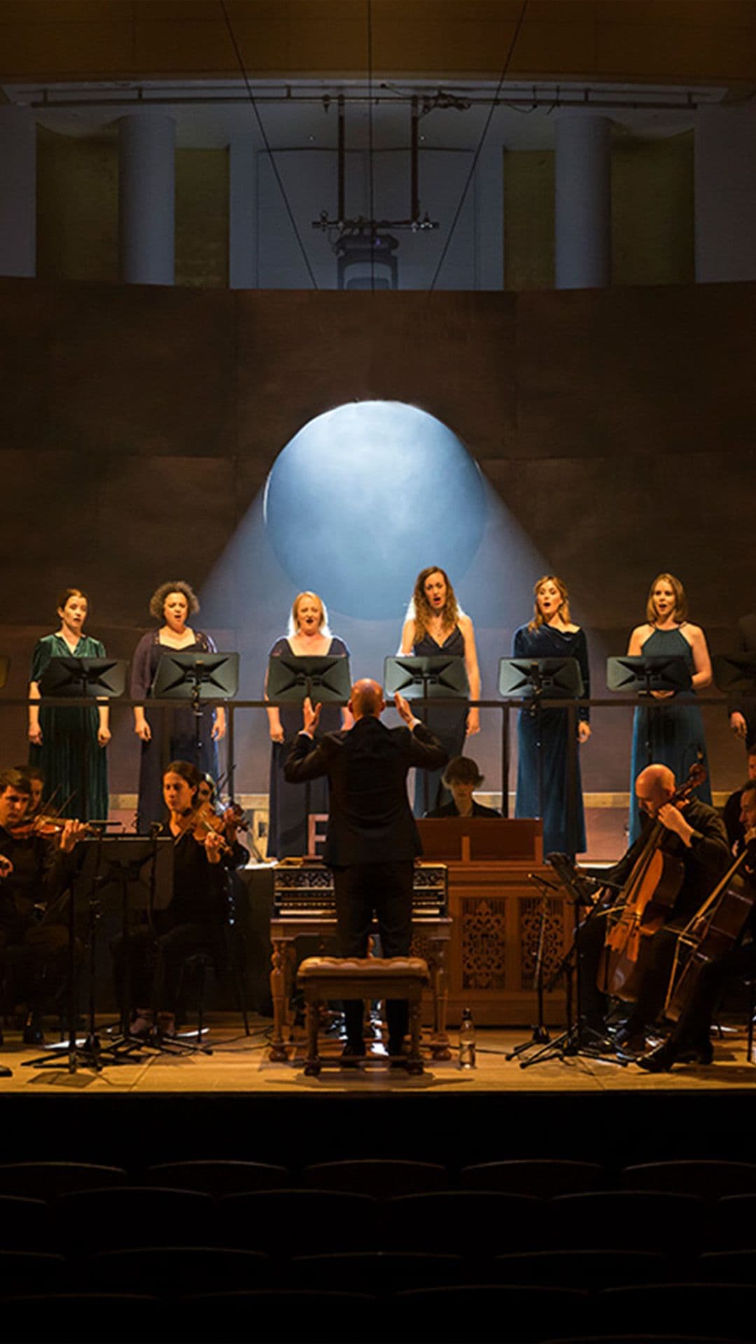 A pile of red-tipped matchsticks against an orange background. One matchstick stands upright in the centre, burning brightly.