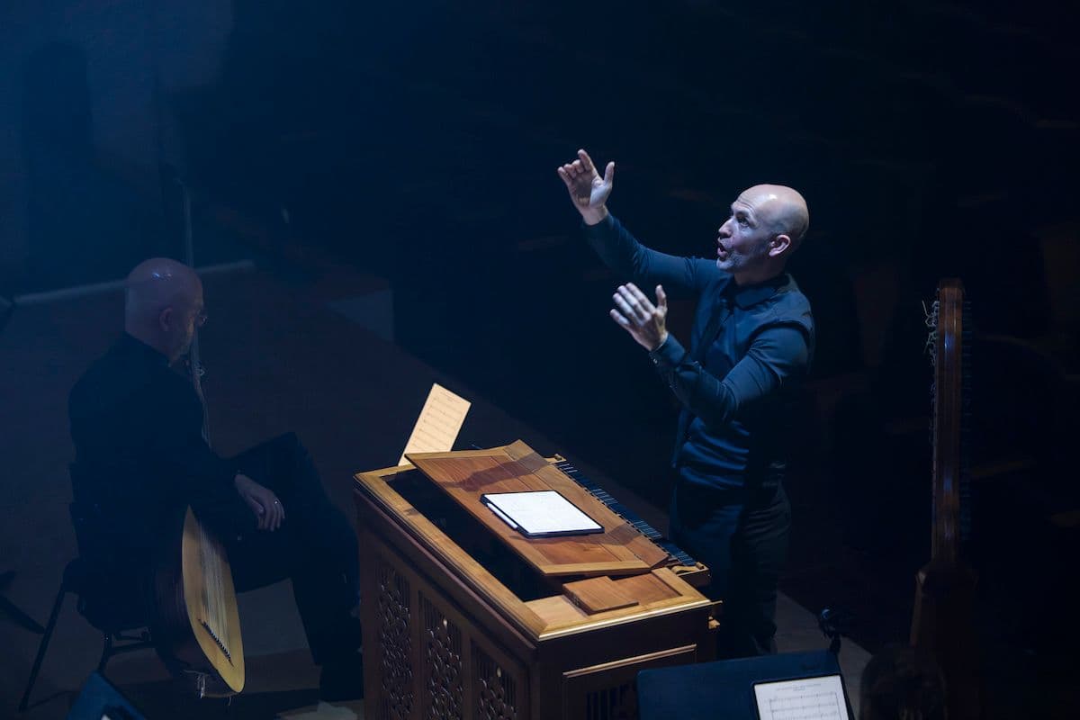 Erin helyard conducts from the organ in Eternal Light